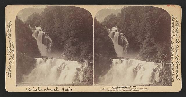 a black and white photo of a waterfall 