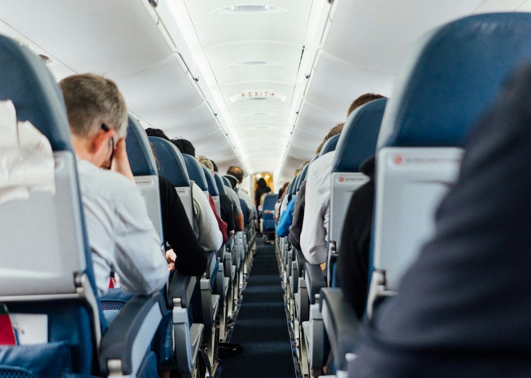 people sitting inside plane