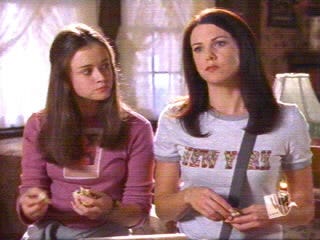 Rory and Lorelai eating scones at The Cheshire Cat B&B. 