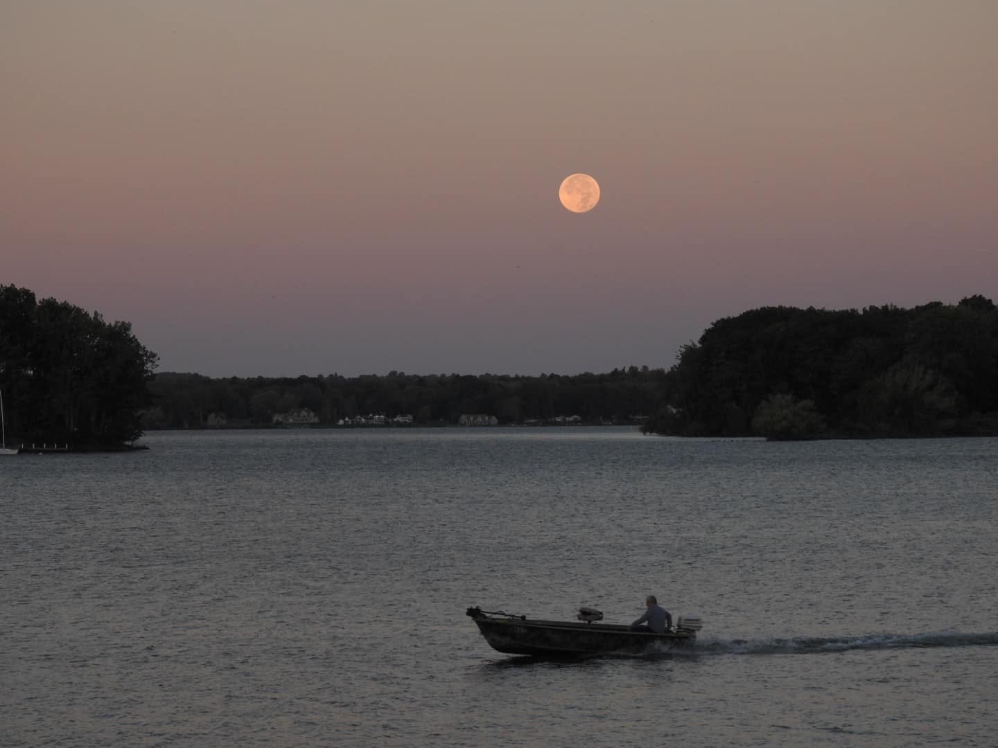 May be an image of 1 person, boat and lake May be an image of 1 person, boat and lake