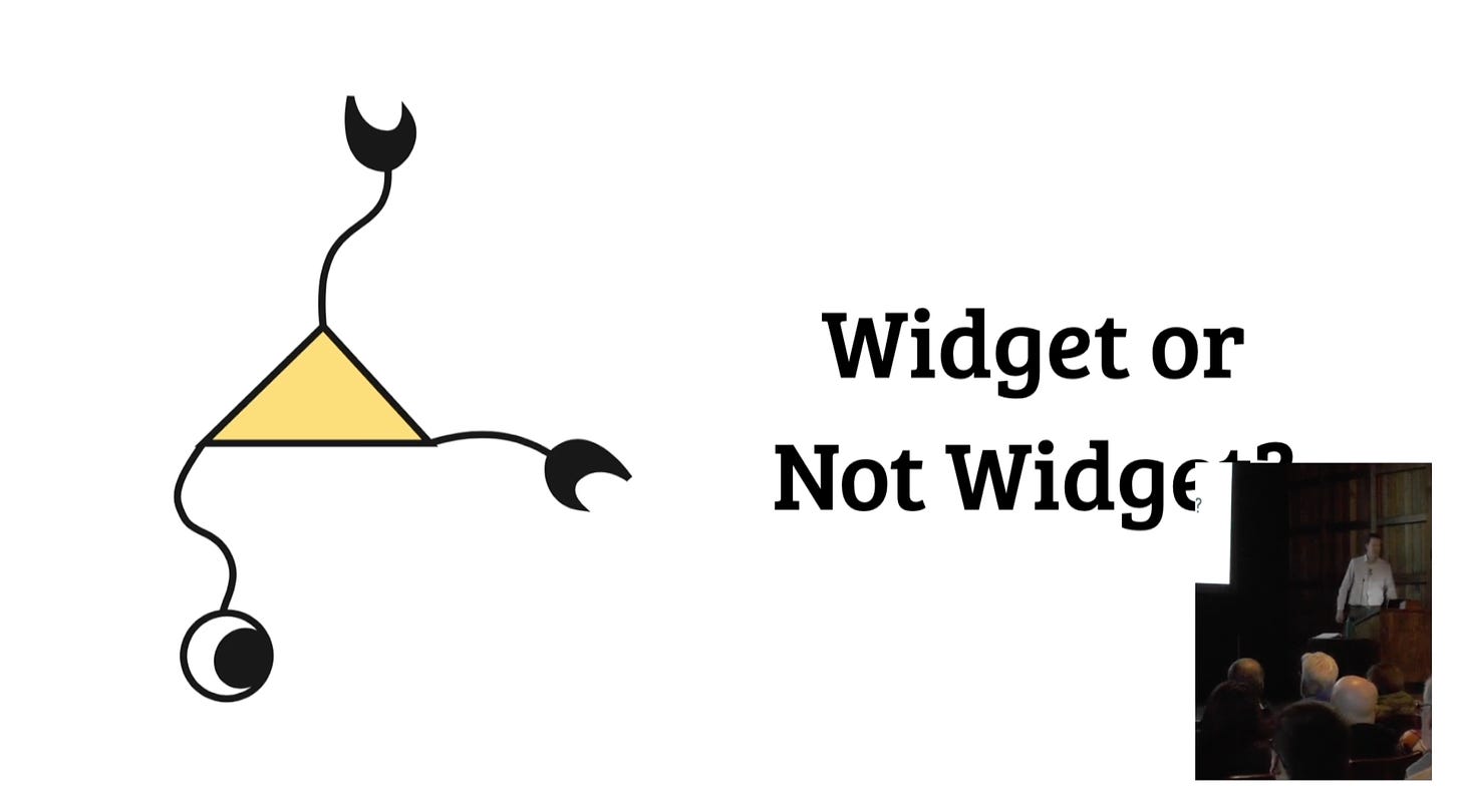 An image of a triangle with tentacles, claws, and an eye attached and the text "Widget or Not Widget?"
