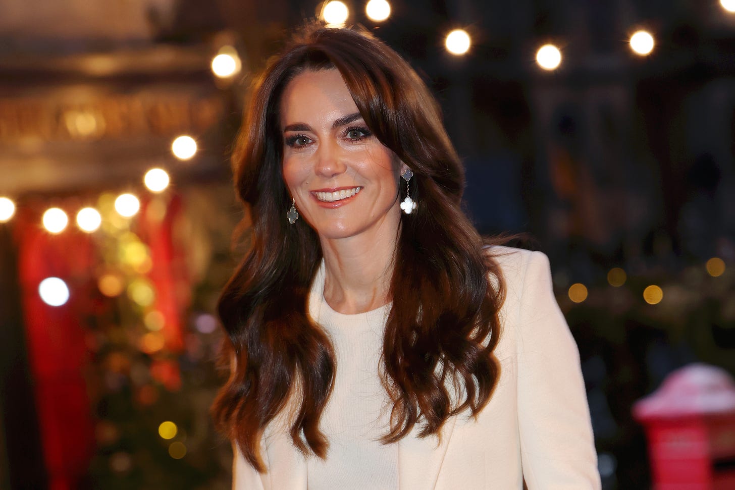 Princess Kate smiling and wearing white