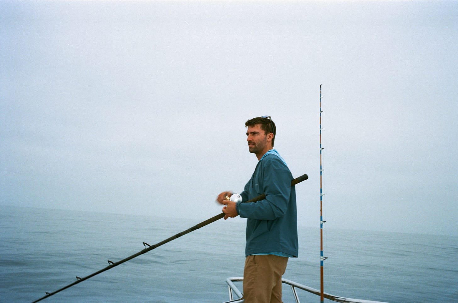 Danny Miller reeling in a tuna
