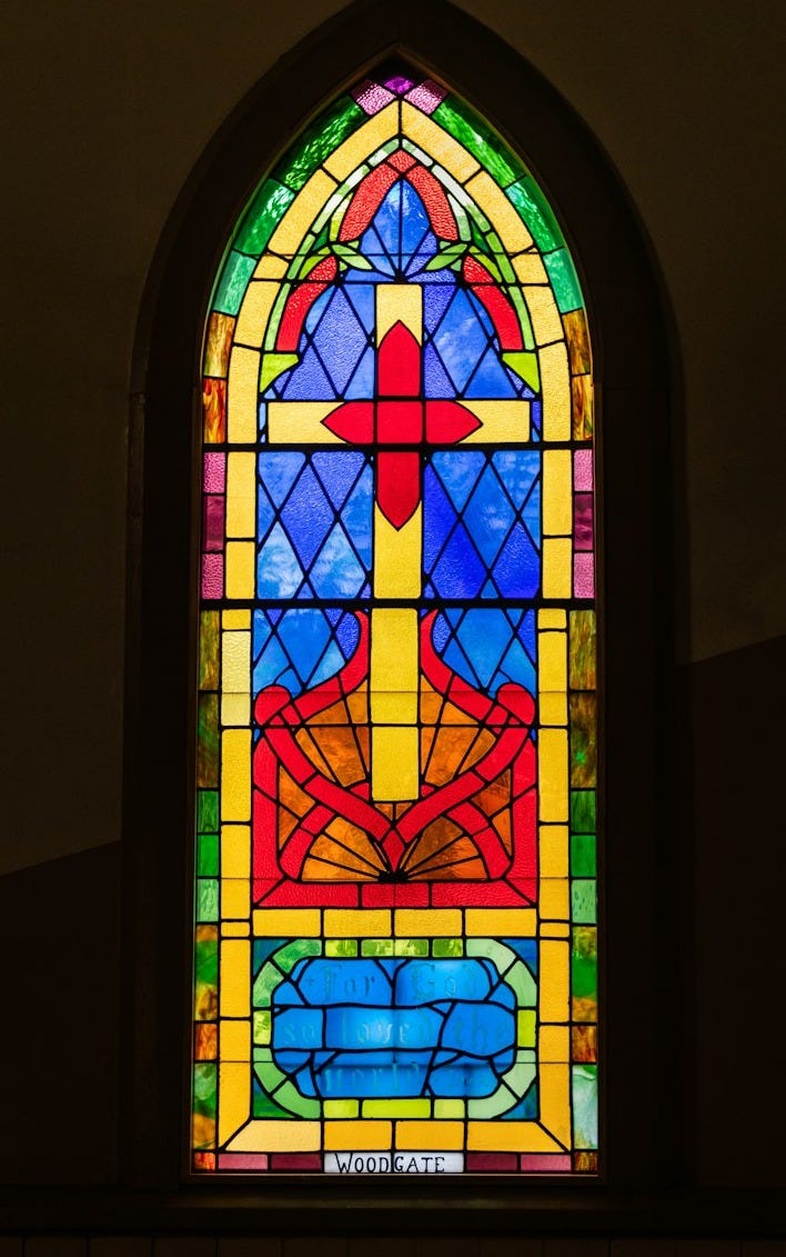 a stained glass window in a church a stained glass window in a church