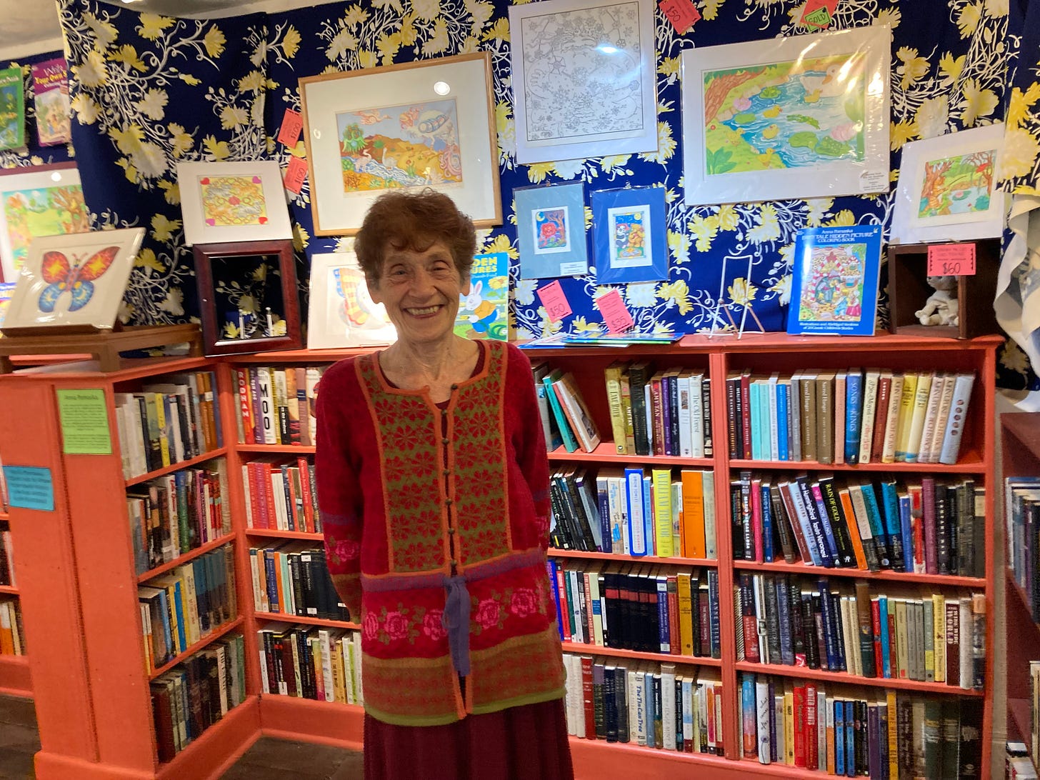 Artist Anna Pomaska in front of some original prints she made for Dover's line of activity and coloring books. Photo by Adele Uphaus.