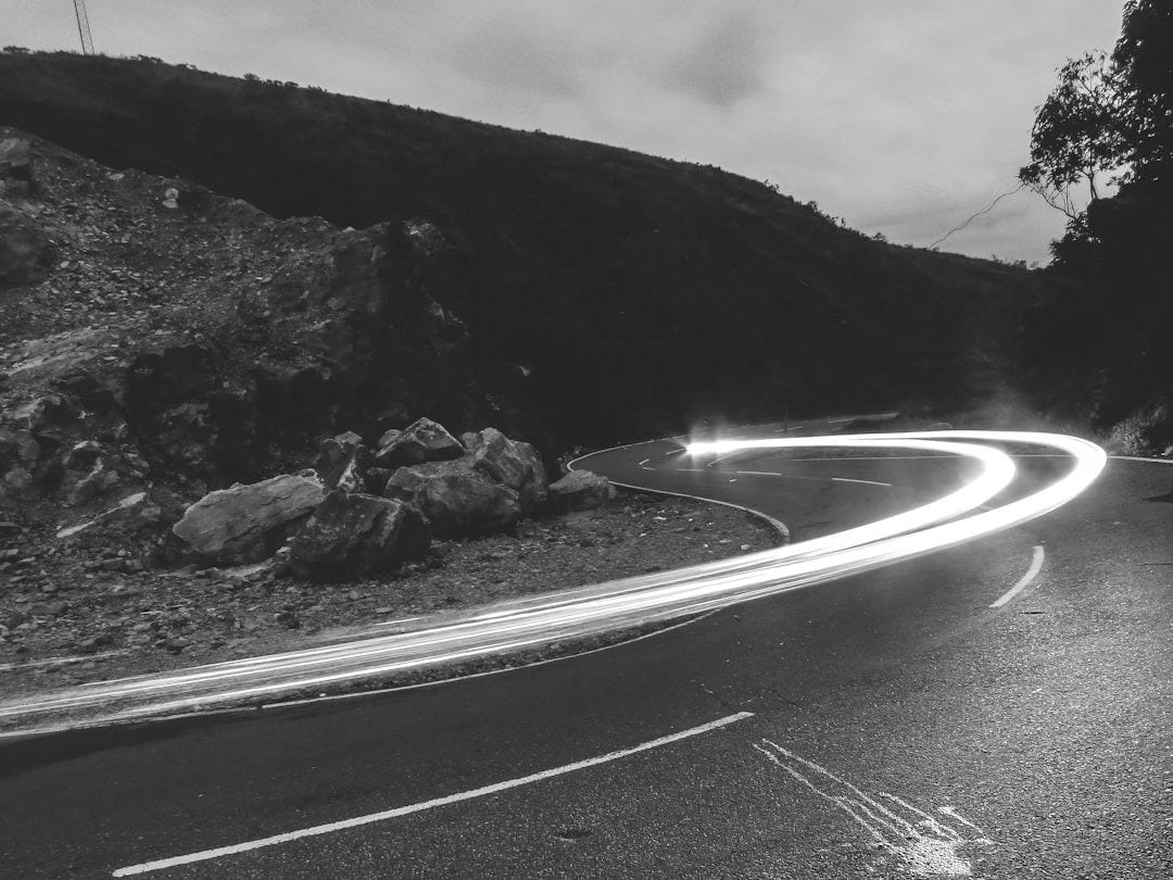 lighted light on road during nighttime lighted light on road during nighttime
