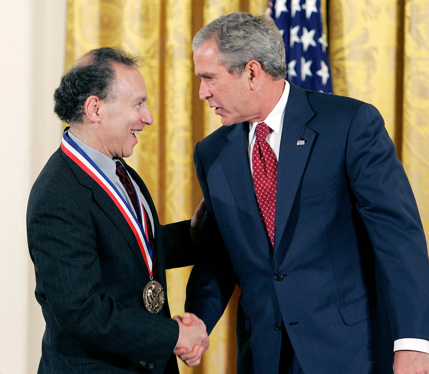 27 Jul 2007, Washington, DC, USA --- U.S. President George W. Bush (R) awards the 2006 National Medal of Science to Robert Langer (Massachusetts Institute of Technology) during the awards ceremony for the National Medals of Science and Technology in the East Room of the White House, July 27, 2007. REUTERS/Larry Downing (UNITED STATES) --- Image by © LARRY DOWNING/Reuters/Corbis