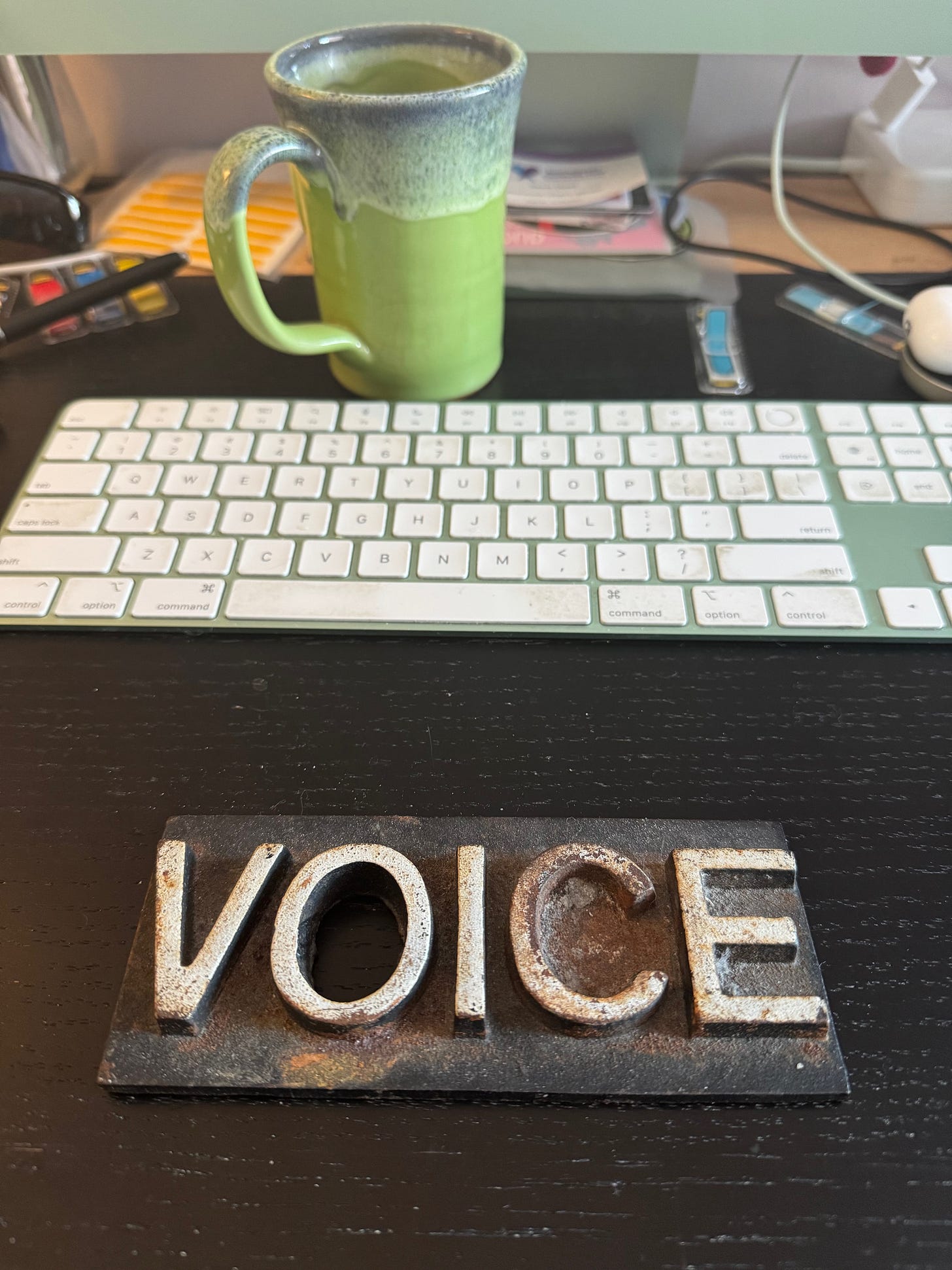 Image of a Village Voice paperweight that once held the paper down at a newsstand