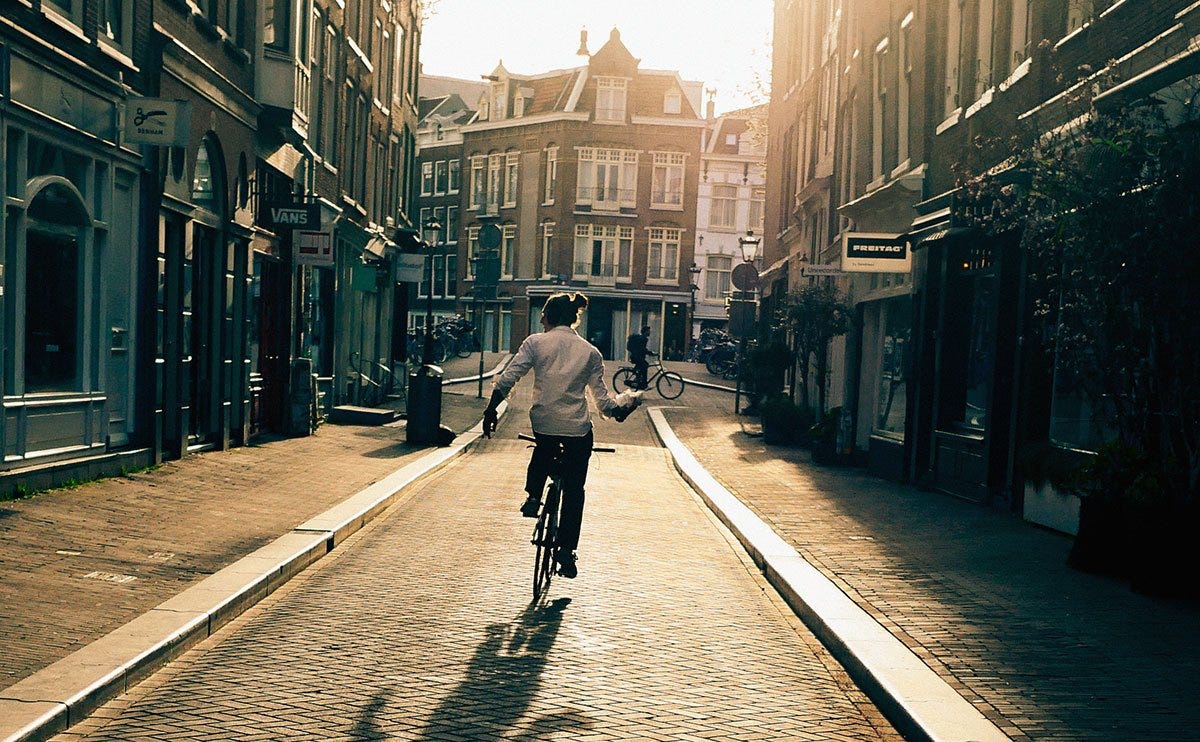 Riding down an empty street in Amsterdam