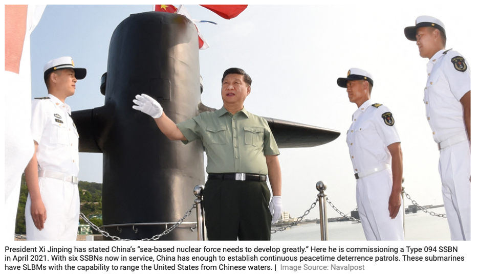 Photo of China's President Xi Jinping on a nuclear submarine with two PLA Navy sailors, on the occasion of the Type 094 SSBN's commissioning in April 2021.