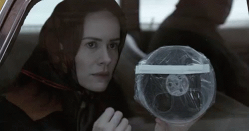 Sarah Paulson in American Horror Story ‘Asylum’, flipping off someone from the back of a car