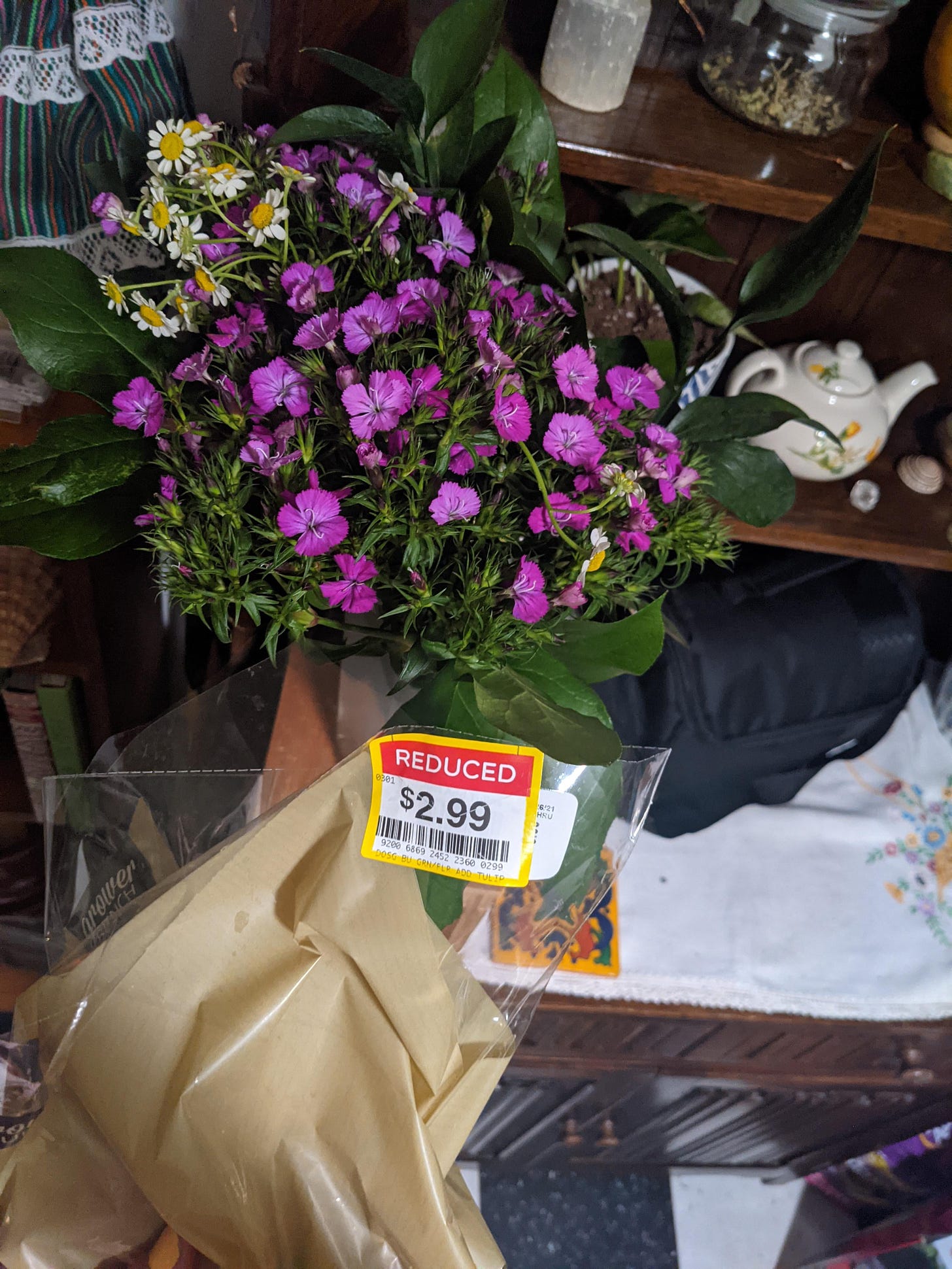 I discovered the Clearance/Reduced rack of flowers at my local grocery store.  I had no idea!! I bought these to thank my partner for their support. Such  a cheap little bouquet! :