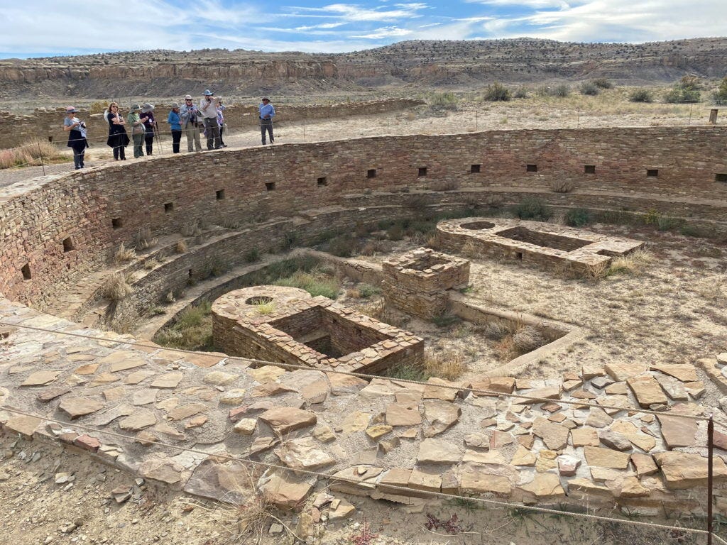 Tourists view Pueblo Bonito, one of a series of Puebloan structures in Chaco Culture National Historical Park believed to ...