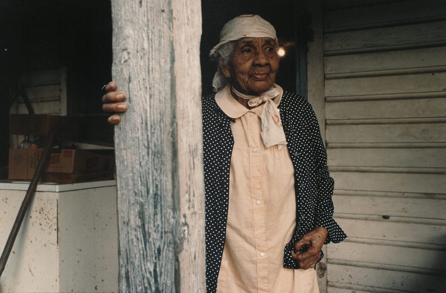 Beatrice Creasy White Bolden, "Aunt Lulee" comes out on the porch to have her picture taken. Bobtown, Louisiana, 1979. Photo by Roland Charles  © Tom and Ethel Bradley Center.