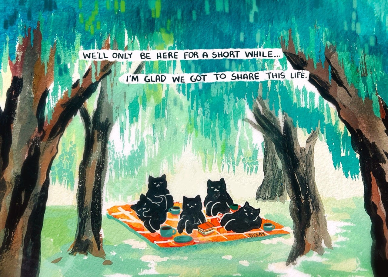 Desenho de 5 gatos (pretos tomando café em uma toalha de piquenique. Eles estão em uma floresta com árvores. Está escrito a frase "we'll only be here for a short while... i'm glad we got to share this life"