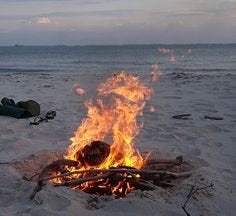 This contains an image of: Beach Campfire