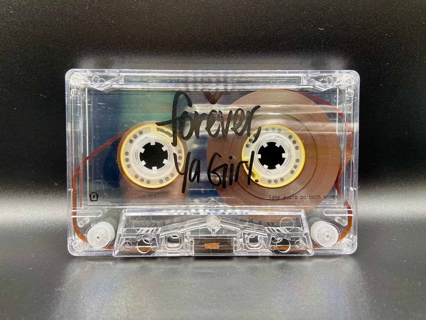 a clear cassette that reads Forever, Ya Girl.