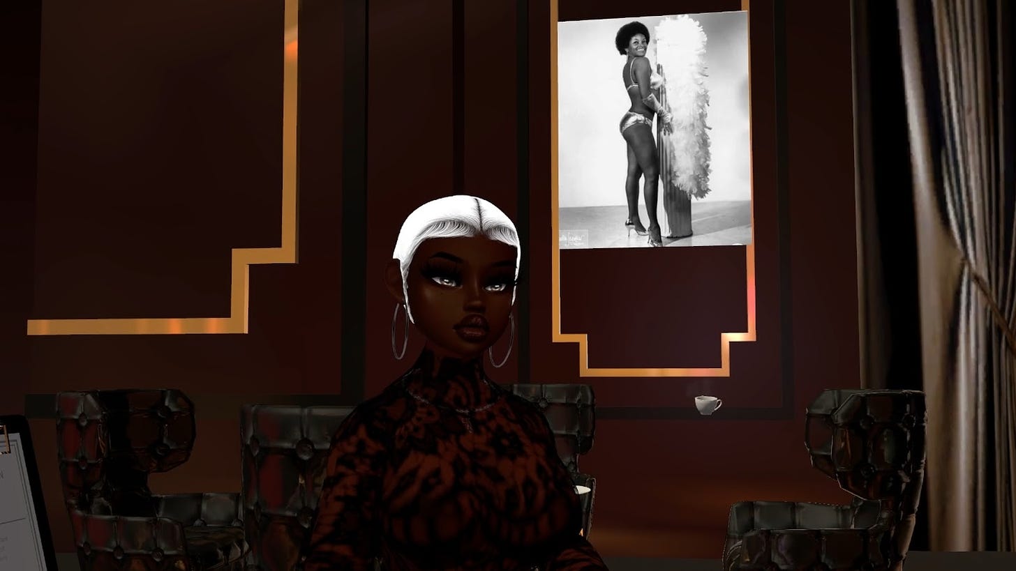 BoogieXR speaks in front of a black and white photograph featuring a Black pin-up girl.