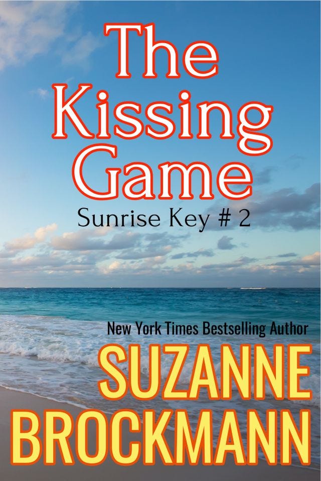 Cover art for New York Times bestselling author Suz Brockmann's THE KISSING GAME (Sunrise Key #2) features a beach with a blue sky and a blue ocean!