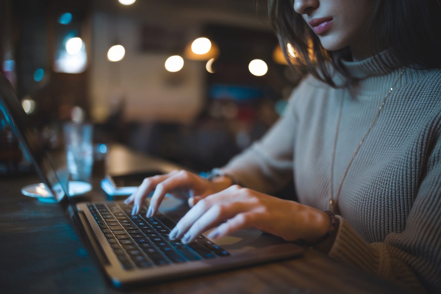 Young woman working in a cafe.