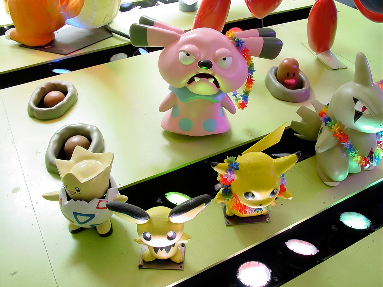 Several other Pokémon from the lower floor window display, featuring Diglett, Togepi, Pichu, Pikachu, Larvitar, and Snubbull