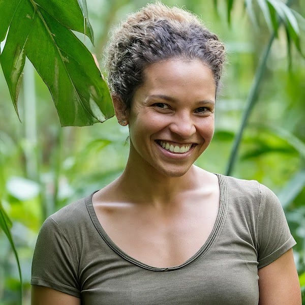 A shot of a 32-year-old female, up and coming conservationist in a jungle; athletic with short, curly hair and a warm smile