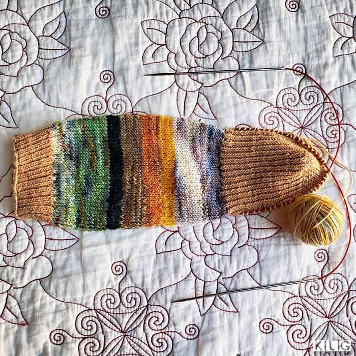 Twisted stitch heel flap on my Striped Socks. Koigu handpainted yarns in greens, browns, oranges and creams.