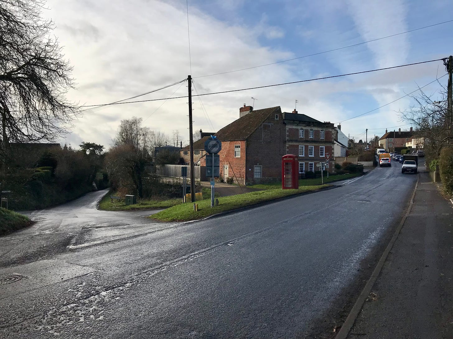 The Wiltshire village of Chapmanslade. A telephone box stands on the tiny green.