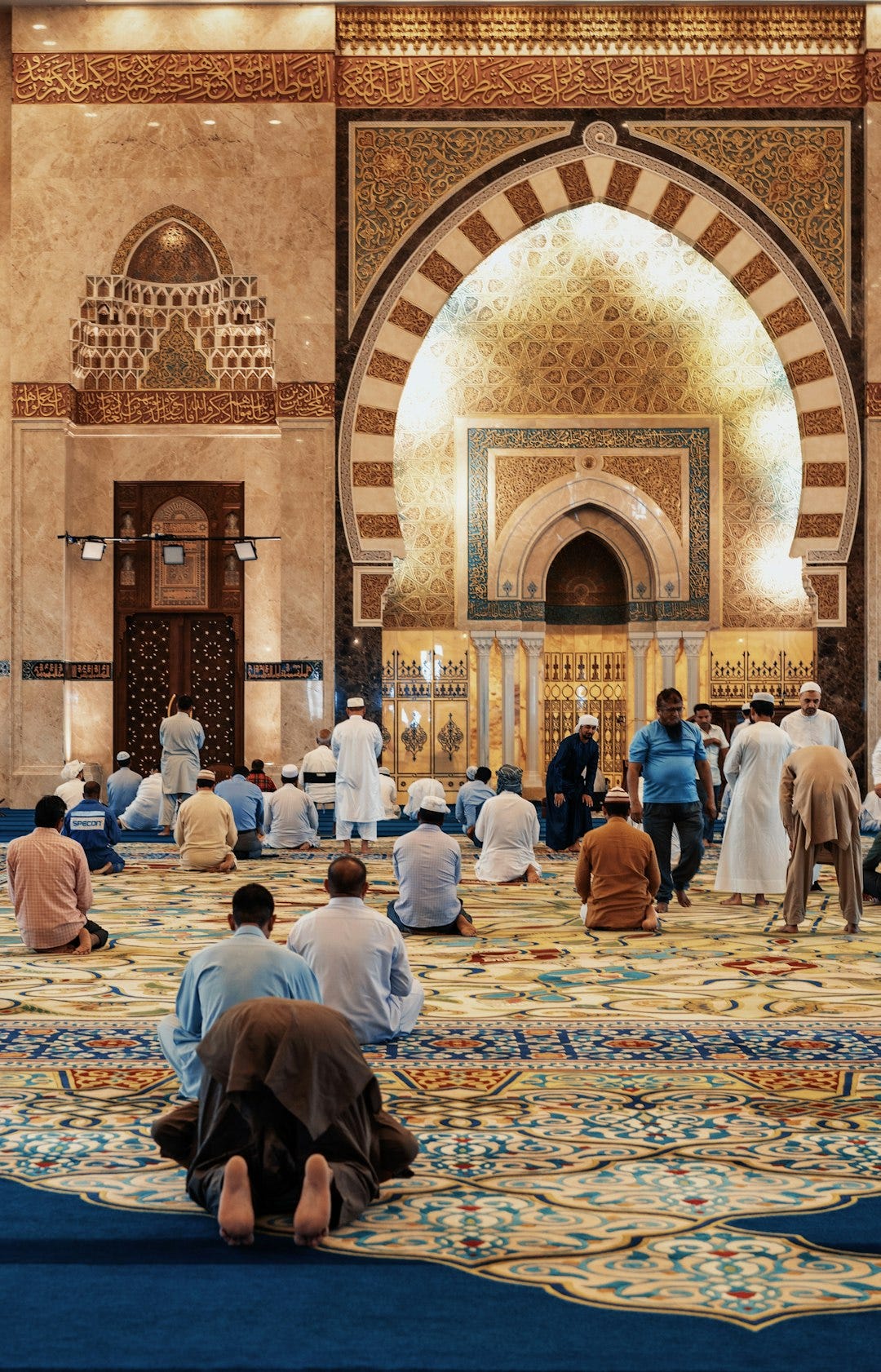 men kneeling and bowing inside building men kneeling and bowing inside building