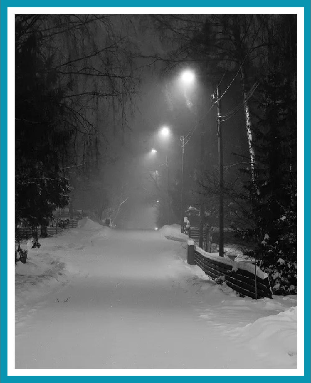 Snowy street at night