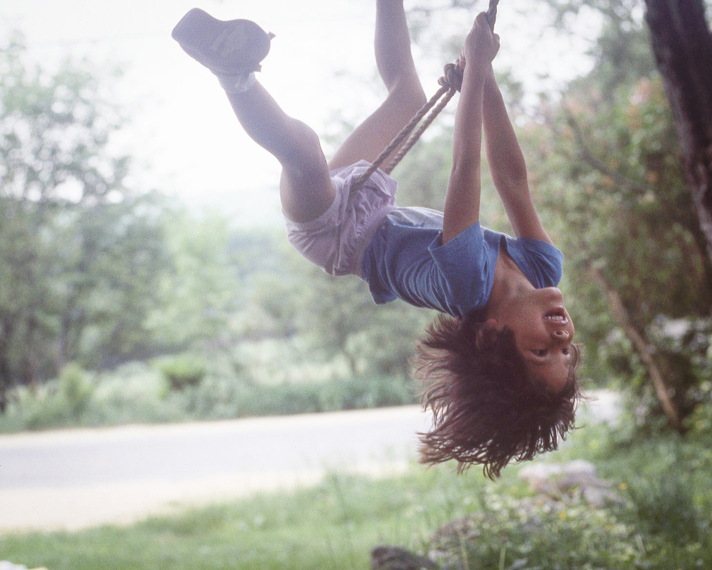 My daughter swinging on a rope