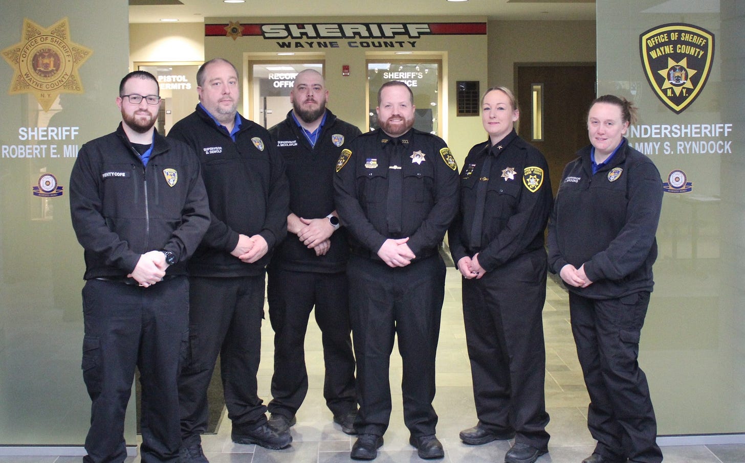 May be an image of 6 people, ambulance and text that says 'γέTe COUNARE PISTOL SHERIFF WAYNE COUNTY RECON OFFK SHERIFF'S S SHERIFF ROBERT E. ROBERTE.MII MII RFFICE OF SHERIFF WAYNE WAYNECOUNTY COUNTY スい EITECOFE വ NDERSHERIFF MMY S. RYNDOCK মলানিা 合国体'