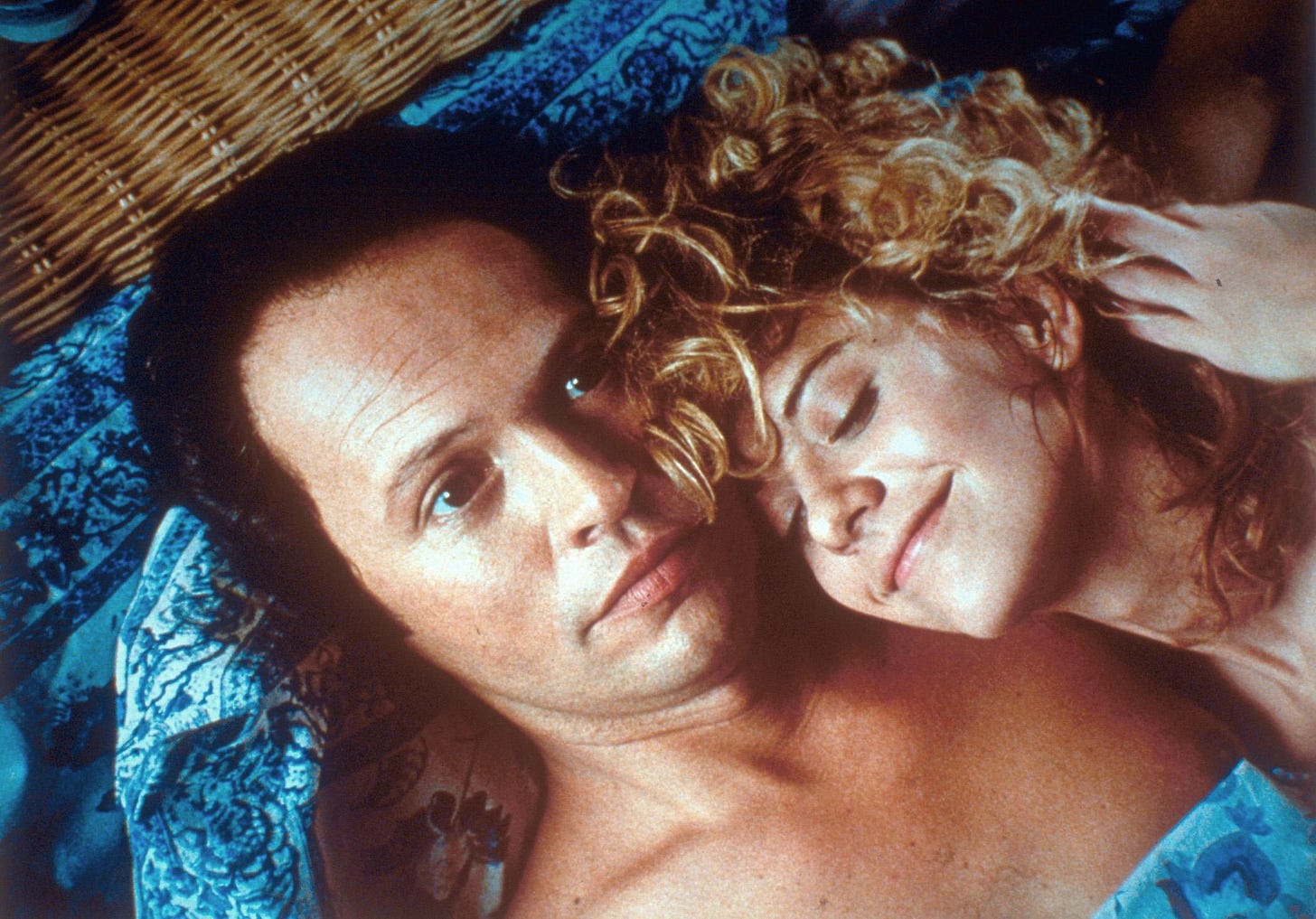 Harry and Sally in bed together. She looks happy, he looks horrified