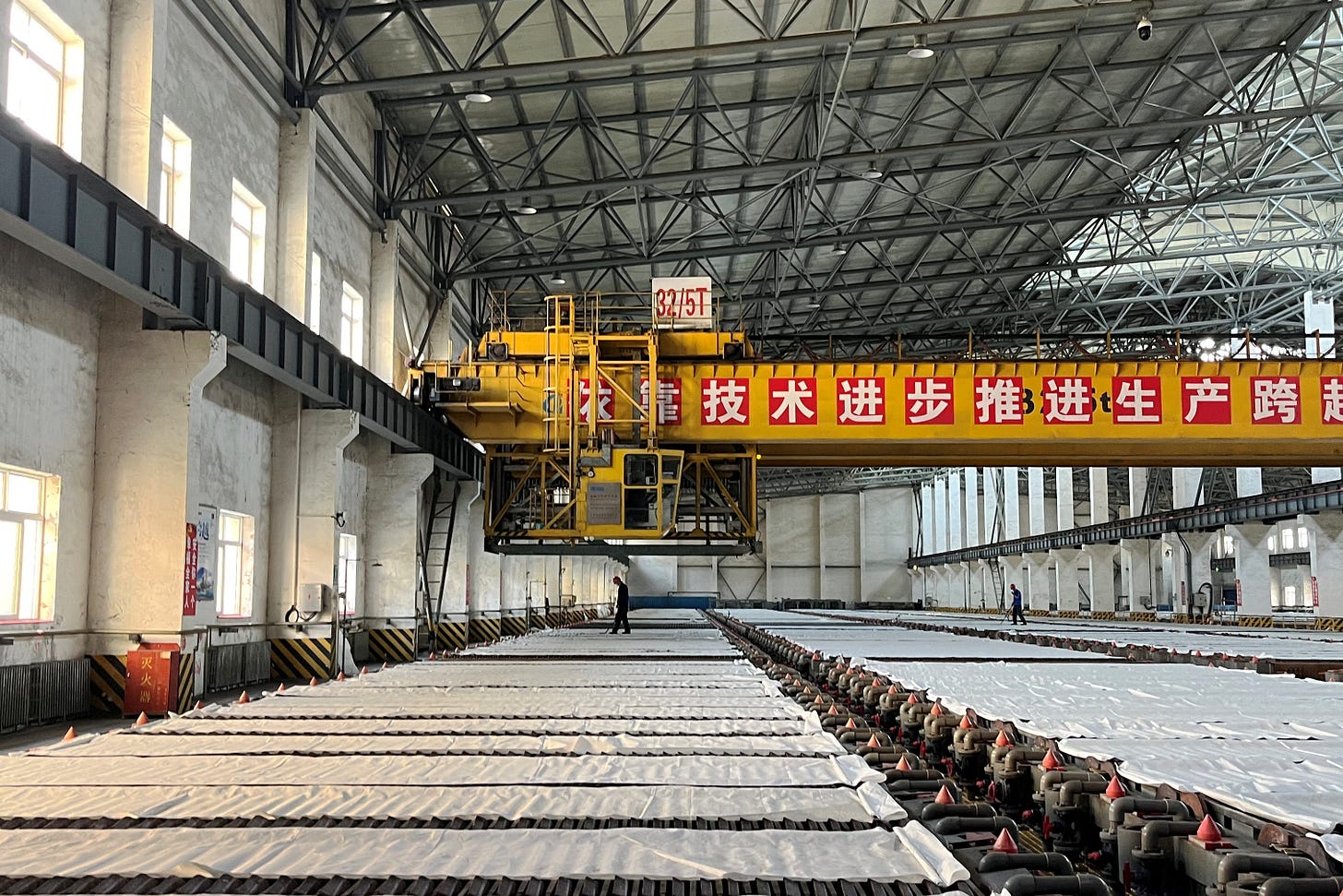 Employees work at a copper smelter in Yantai