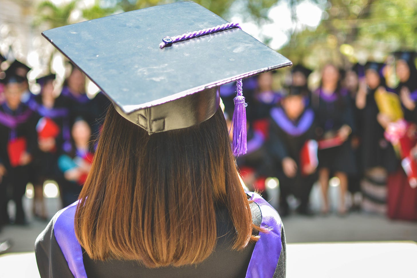 Picture of the back of a person graduating from university