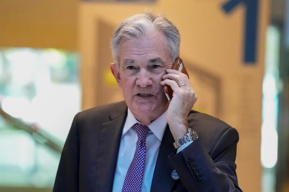 Federal Reserve Chairman Jerome Powell, talks on the phone before attending the International Monetary and Financial Committee (IMFC) plenary session at the International Monetary Fund Building in Washington, D.C., U.S. April 14, 2023. REUTERS/Ken Cedeno
