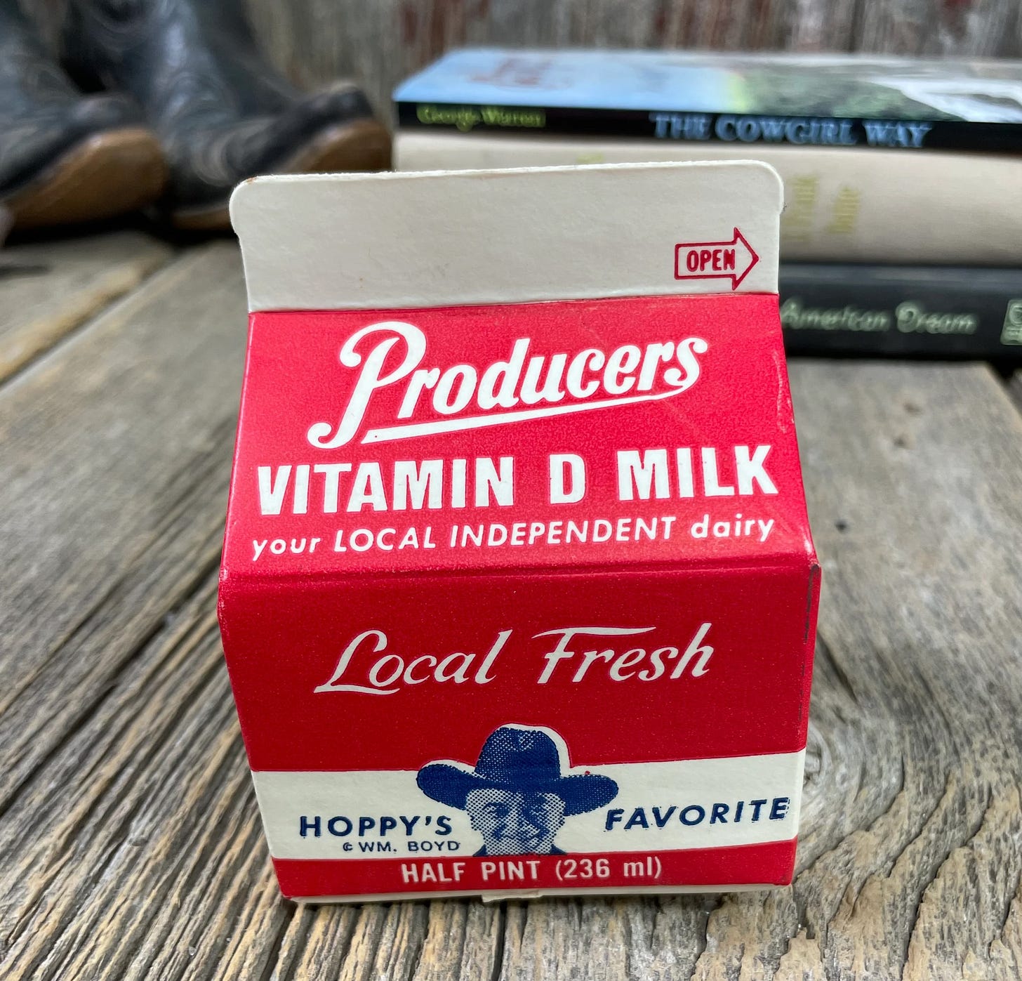  photo of a half-pint cartoon of Producers Vitamin D Milk. There’s a photo of Hopalong Cassidy on the carton and the words “Hoppy’s Favorite! ©vWm. Boyd.”