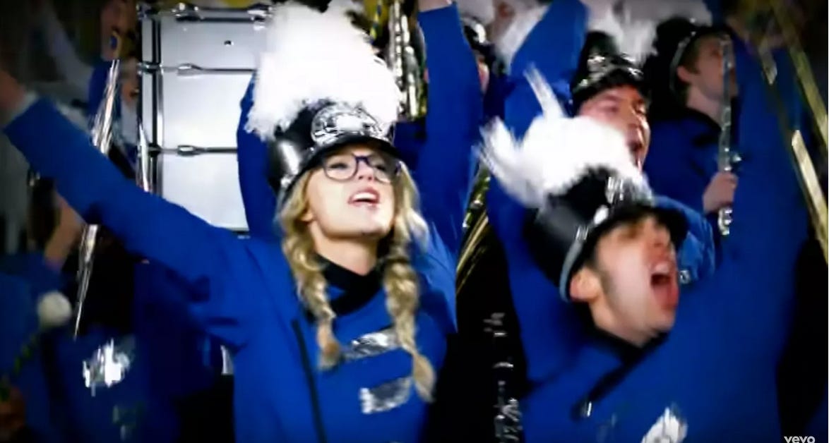 Screen shot of Taylor Swift dressed as a marching band performer from the video for You Belong to Me