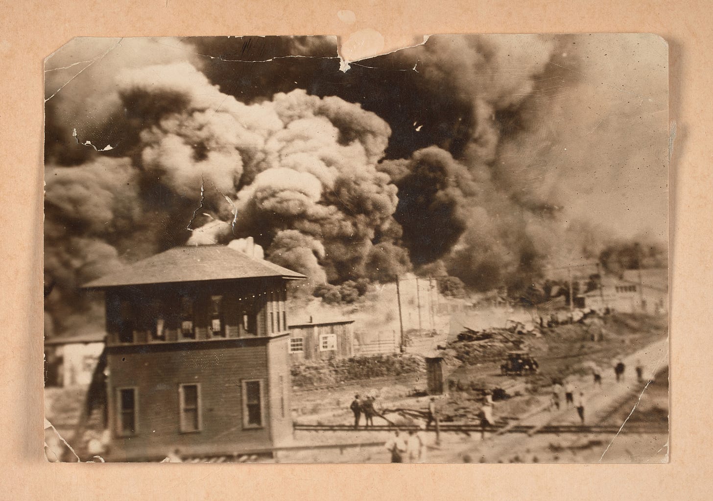 Photograph of the Greenwood District burning during the Tulsa Race Massacre