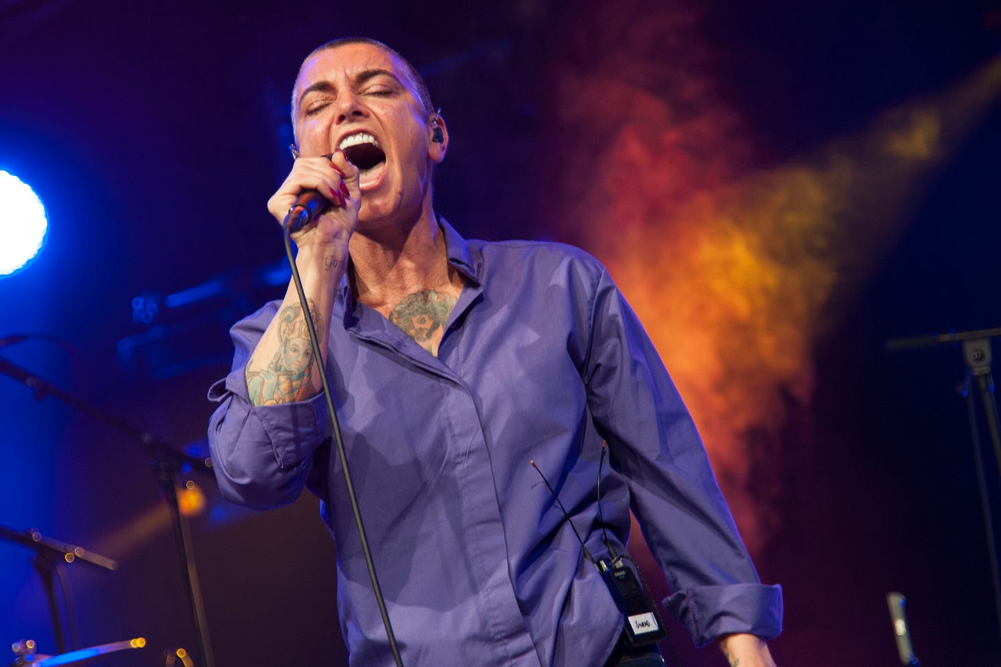 Sinéad O’Connor singing at the Cambridge Folk Festival in 2014