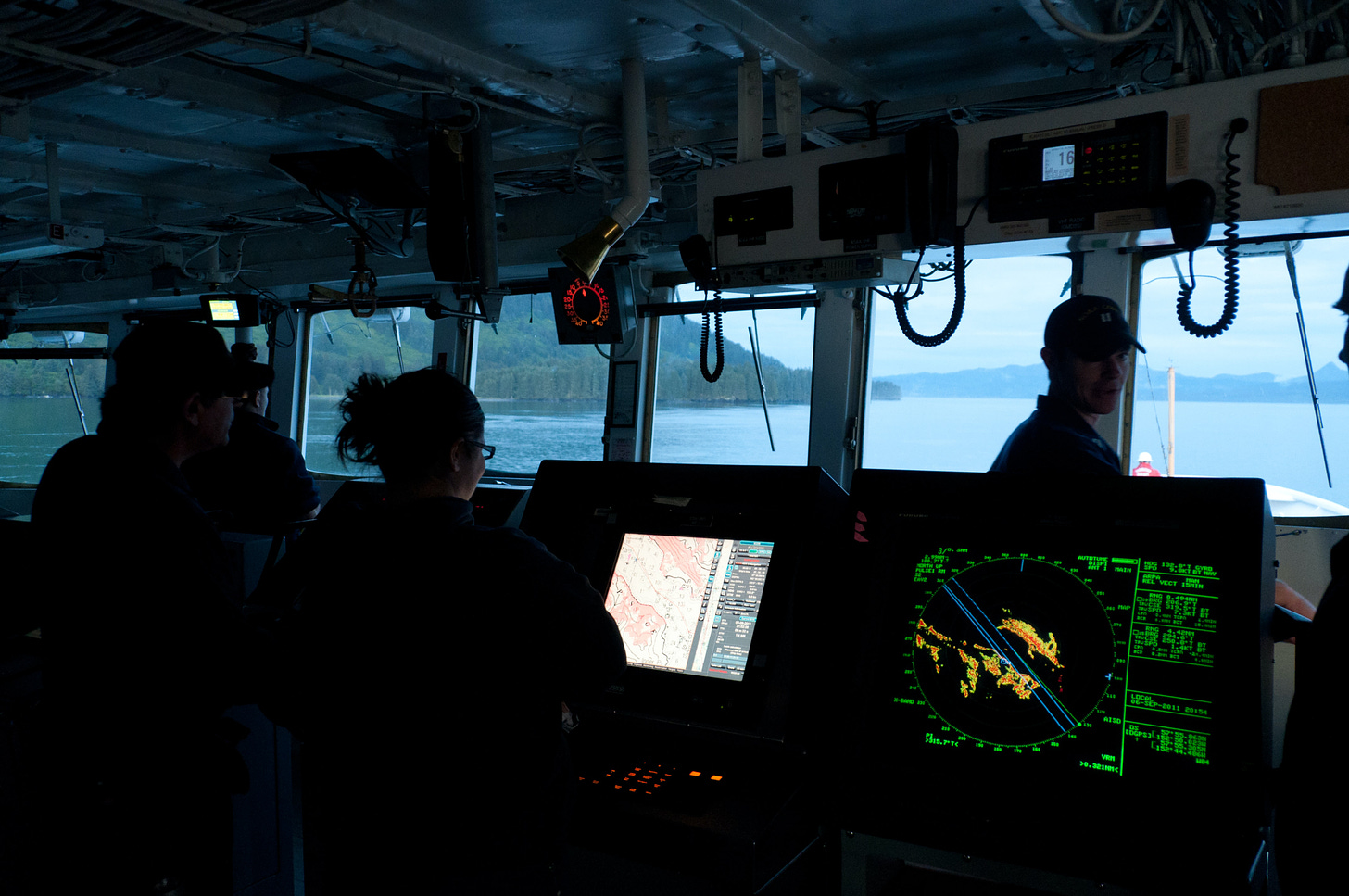 Marine scientists in a vessel. 