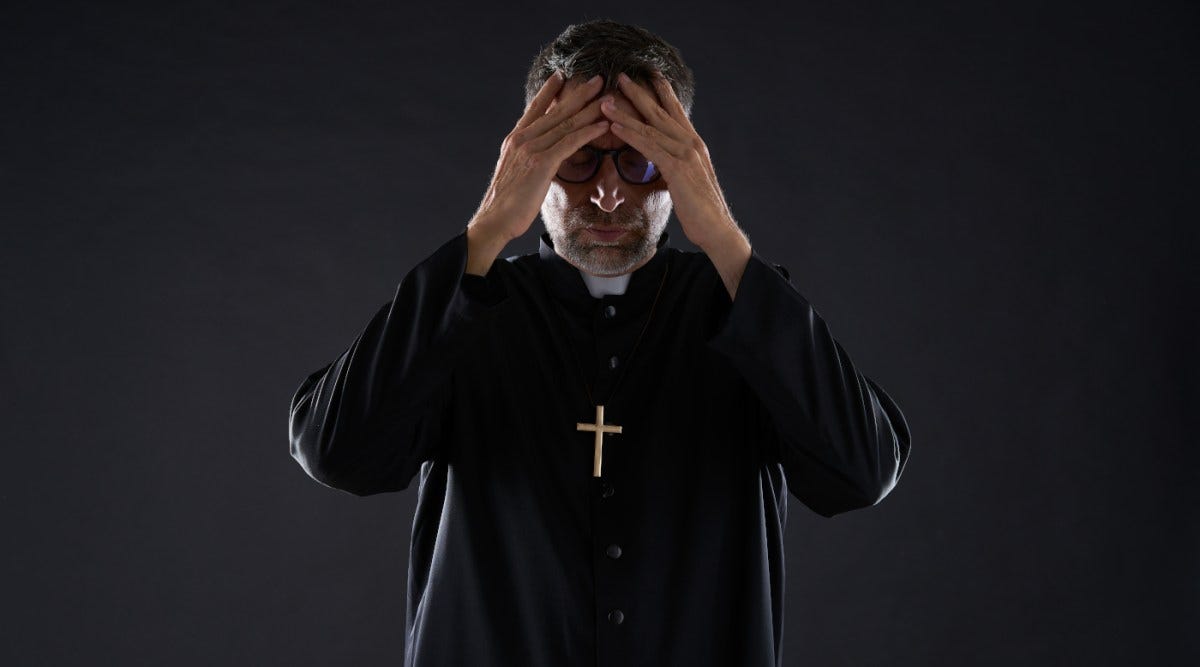Report: 188 Catholic clergy members in Kansas are alleged predators | Catholic priest with hands on his head
