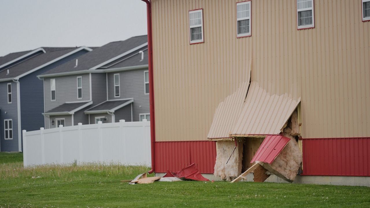 Damage is visible at the scene after a car barreled through a building used for an after-school camp Tuesday, April 29, 2025, in Chatham, Ill. (AP Photo/Erin Hooley)