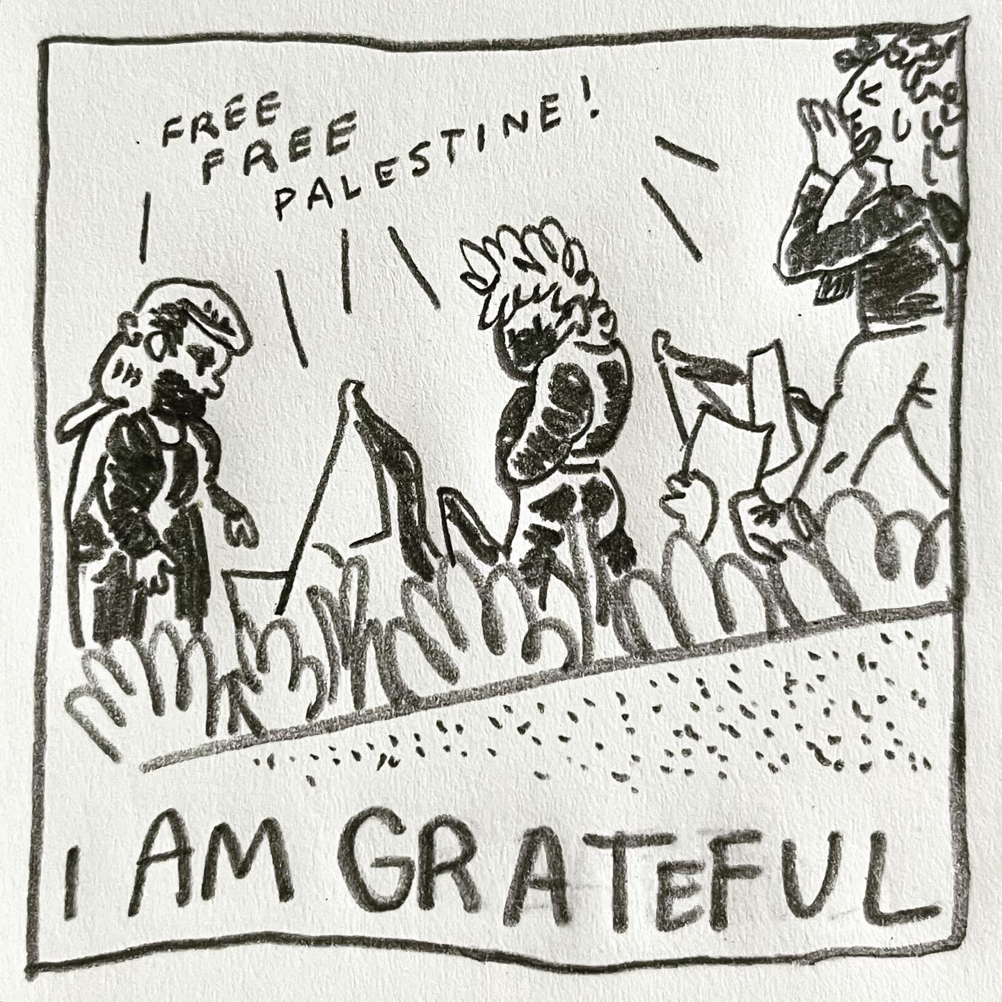 Panel 3: I am grateful Image: a view from below a concrete barrier. Looking up, we see Lark, wearing a mask and a black jacket, looking backwards and down at us. Bushes are in the foreground. People holding flags and signs march past in the same direction as Lark. Many voices are chanting “free free Palestine!"