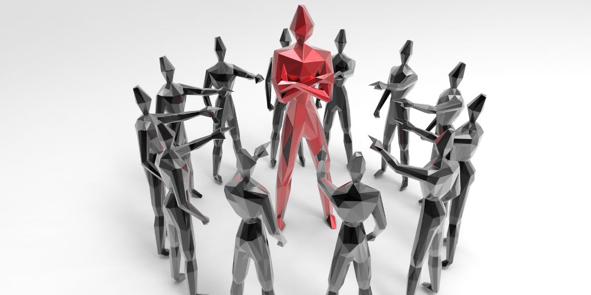 The image shows a tall red robot standing in the centre surrounded by shorter white robots. The image is part of the article titled “Manglik Dosh Types - Does Mangal Dosha negatively affects us?” authored by Anish Prasad and published at https://rationalastro.org