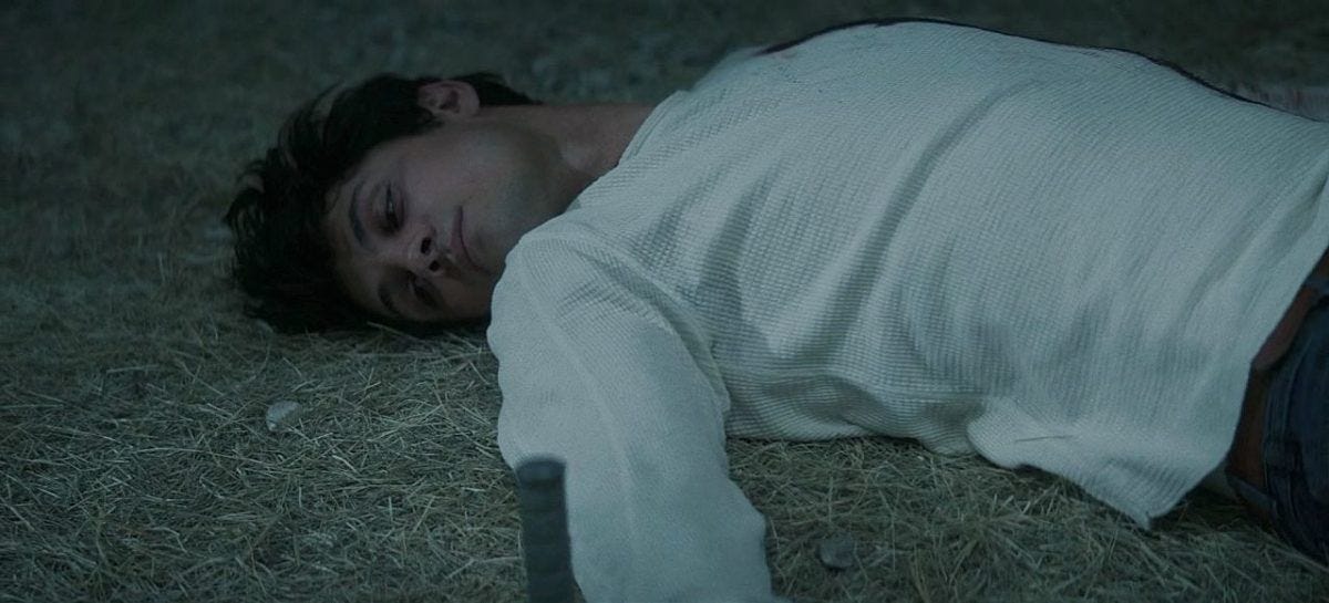 Drake Rodger laying on ground after demon penetrates infects him on The Winchesters.