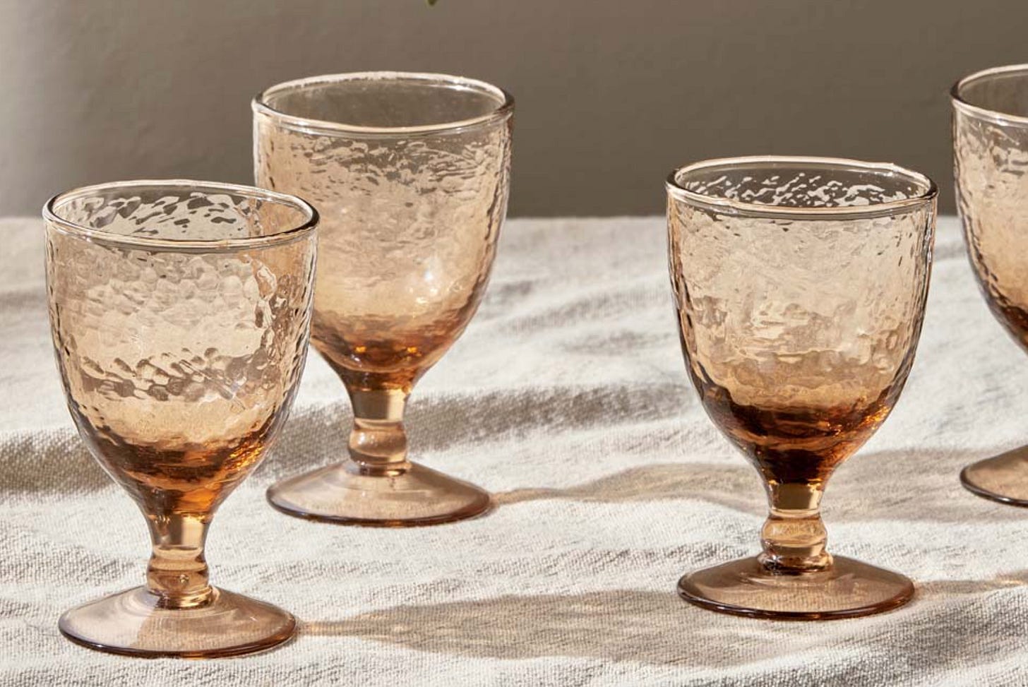 short stemmed sturdy wine glass is dusty terracotta toned glass