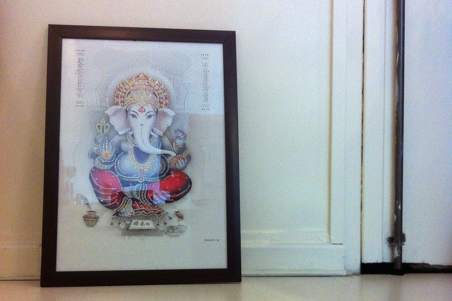 Ganesh guards the threshold of a yoga studio in Paris, France