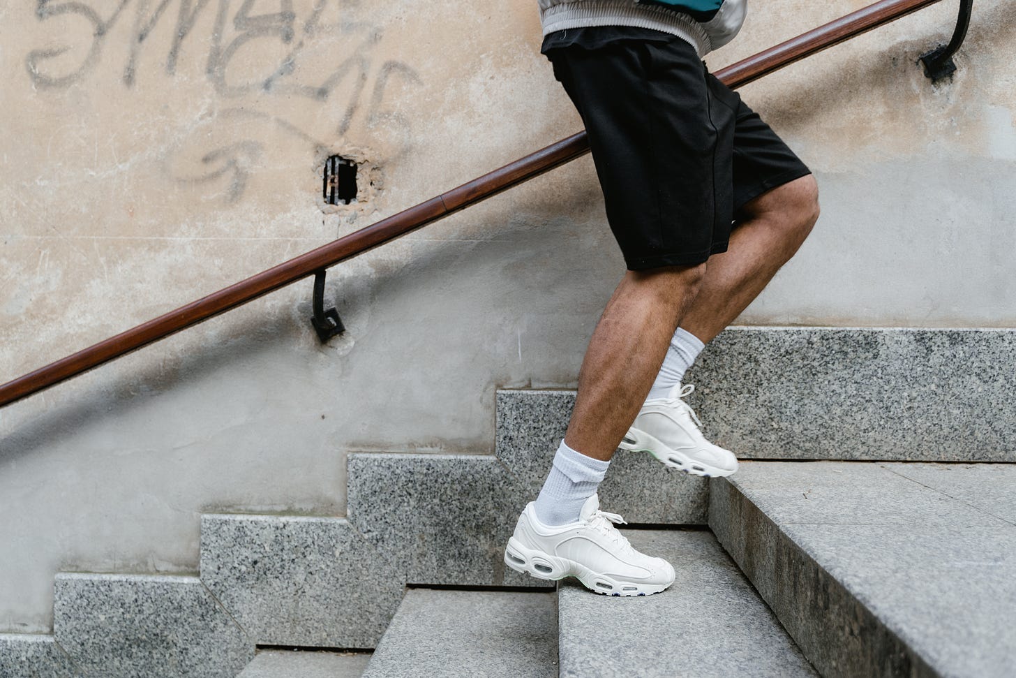 Man Running Up Concrete Stairs