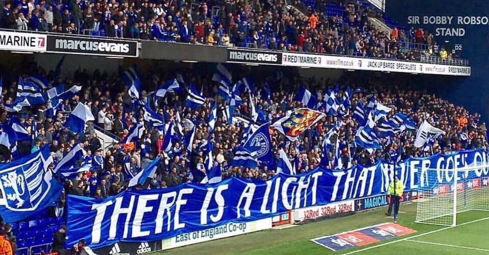 Ipswich banner running the length of the North Stand, with the slogan "There is a light that never goes out", 2019